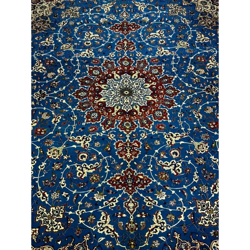 Elegant Floral and Geometric Patterns on Blue Persian Rug – A detailed image capturing the vibrant floral and geometric patterns across the blue field of a Persian rug, bordered by sophisticated accents of red, ivory, and gold, blending traditional artistry with luxurious elegance.
