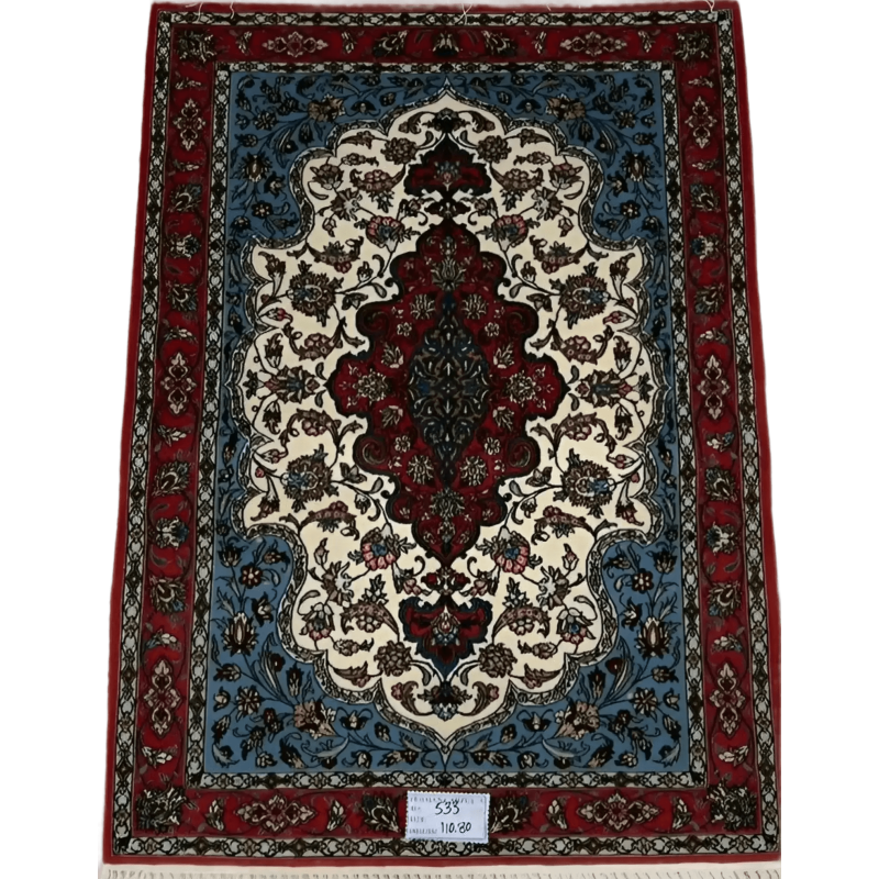 "Hand-knotted Isfahan Persian rug in vibrant red, blue, and ivory tones featuring intricate floral patterns, crafted from silk and wool for a luxurious addition to any home décor."