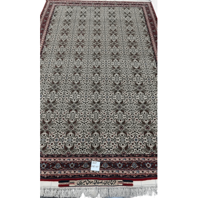 "Hand-knotted Sadegh Seirafian Persian rug featuring intricate symmetrical floral motifs with high knot density, originating from Isfahan."