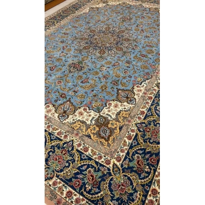 "Detailed corner view of a Persian Sheikh Bahaie rug, with floral motifs and a blend of silk and wool."