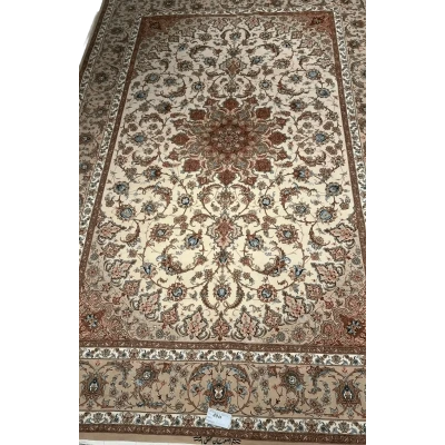  "Hand-knotted luxury Persian rug made of silk and wool from Isfahan, featuring traditional Iranian patterns, 9.8x6.5 feet, crafted by skilled weaver Mohaghegh." ​