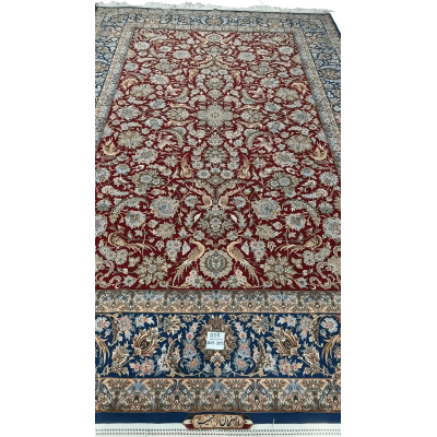 Hand-knotted red and blue Persian rug with intricate floral design