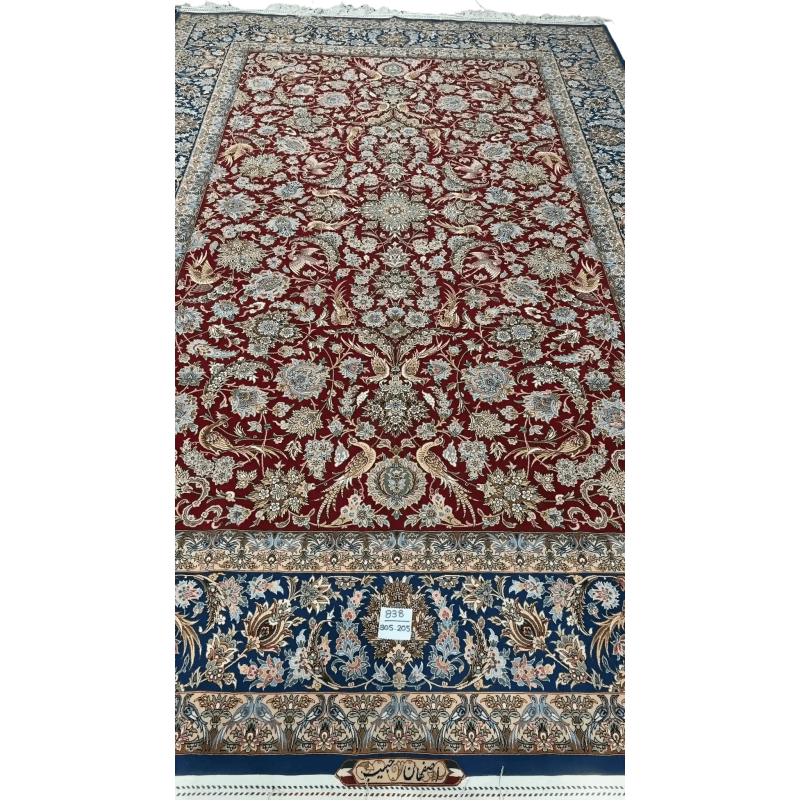 Hand-knotted red and blue Persian rug with intricate floral design