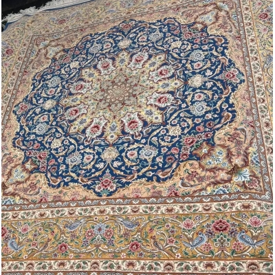 "Square Persian rug, 250 cm, made with wool and silk, handcrafted in Isfahan, Iran. This rug’s vibrant design and premium materials make it a must-have for sophisticated spaces."