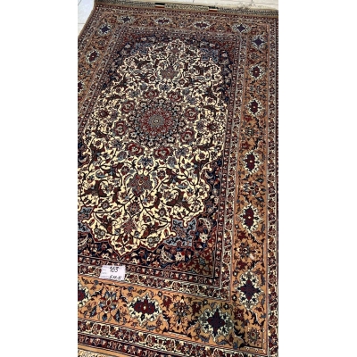 "Authentic Seirafian rug for sale, featuring detailed Persian craftsmanship, made from wool and silk with traditional floral patterns."