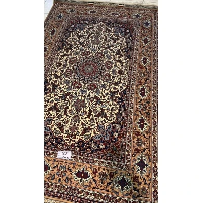 "Authentic Seirafian rug for sale, featuring detailed Persian craftsmanship, made from wool and silk with traditional floral patterns."