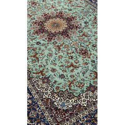 "Close-up of the pure silk and kurk wool blend in Seirafian Isfahan rug with high knot density and floral medallion pattern"