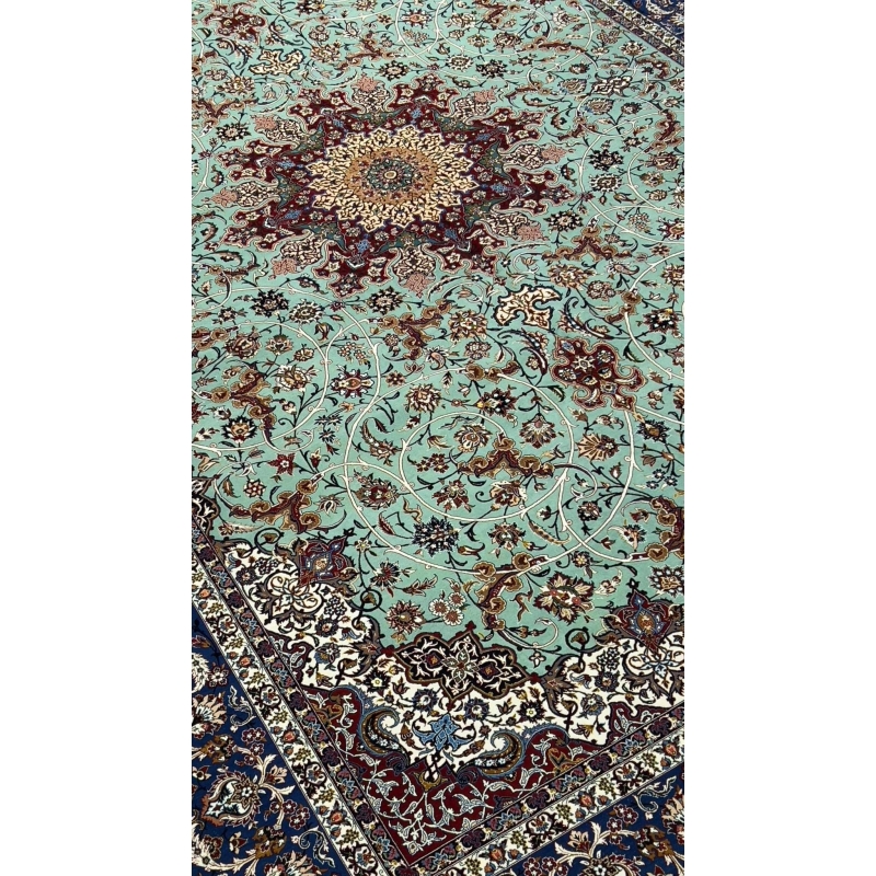 "Close-up of the pure silk and kurk wool blend in Seirafian Isfahan rug with high knot density and floral medallion pattern"