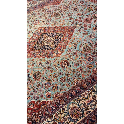 "Close-up of vintage Persian Kashan rug showing floral medallion and high knot density"