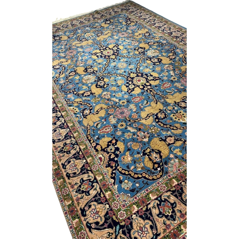 Handwoven Tabriz rug in blue, gold, and pink with natural dyes