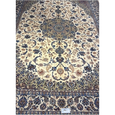 "60-year-old Persian rug with intricate floral patterns and silk-wool blend"
