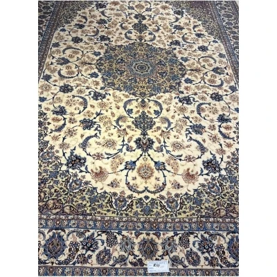 "60-year-old Persian rug with intricate floral patterns and silk-wool blend"
