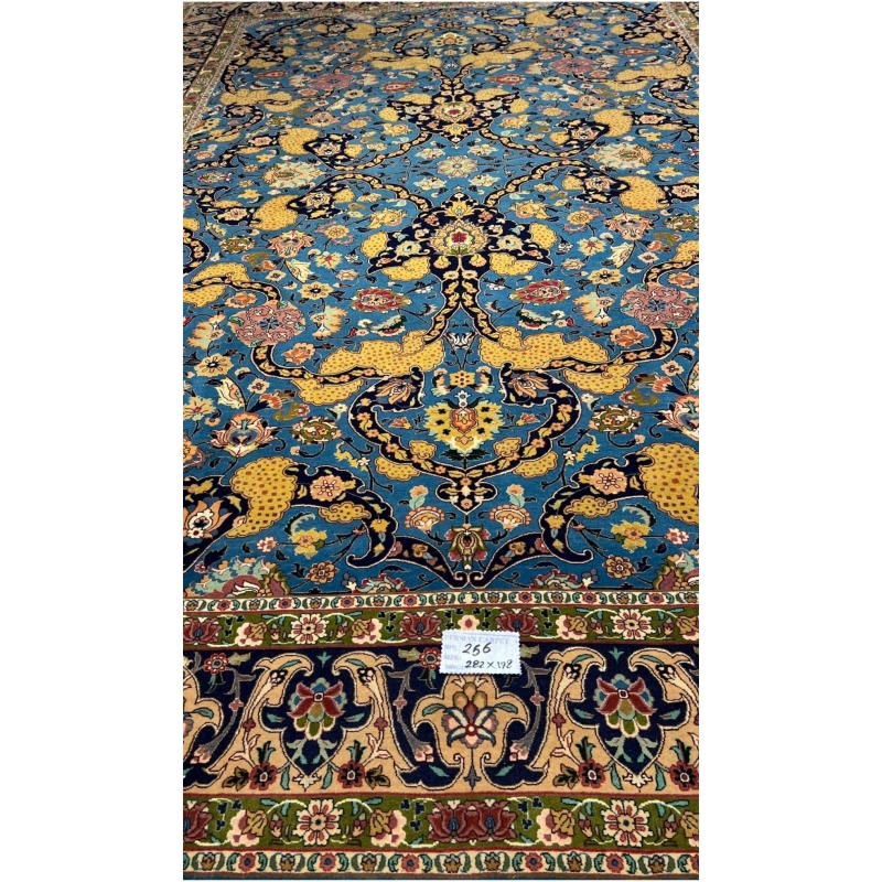 Antique Tabriz rug from Iran, showcasing traditional Persian artistry.