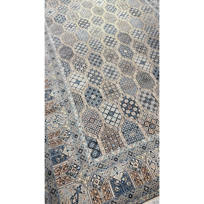 Persian Nain rug in beige, blue, and ivory with intricate hexagonal patterns.