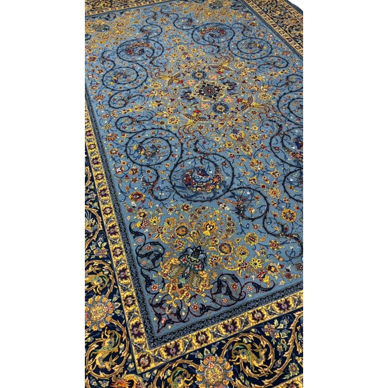 Blue Persian rug with intricate floral and vine patterns, hand-knotted by Mirzaie