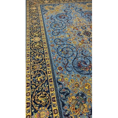 Traditional Persian rug with a blue background and floral motifs