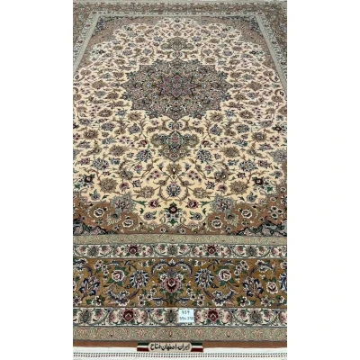 Full display of the elegant beige hand-knotted Iranian rug with floral designs