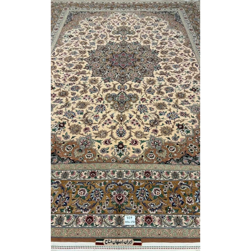 Full display of the elegant beige hand-knotted Iranian rug with floral designs