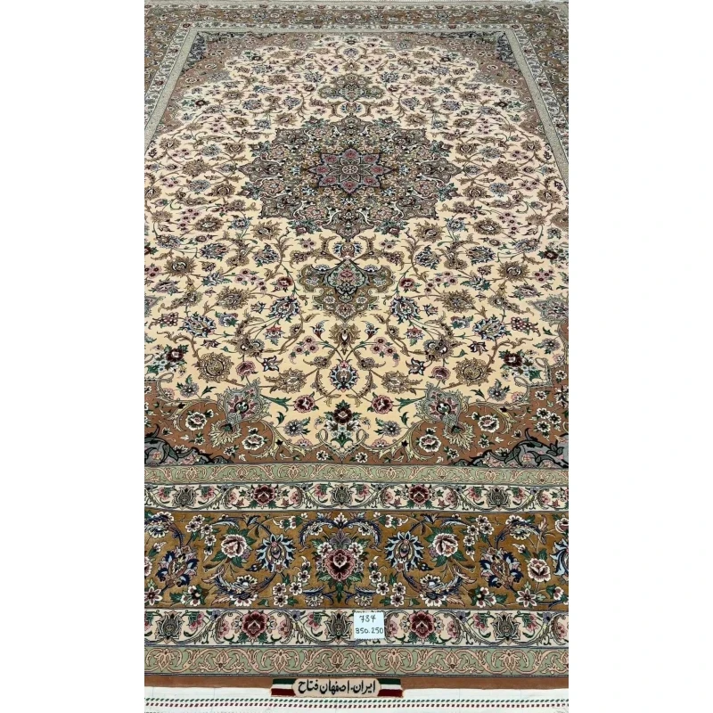Full display of the elegant beige hand-knotted Iranian rug with floral designs