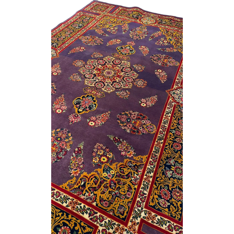 The Elegant Mashad Rug displayed in a room setting to give an idea of its size and design