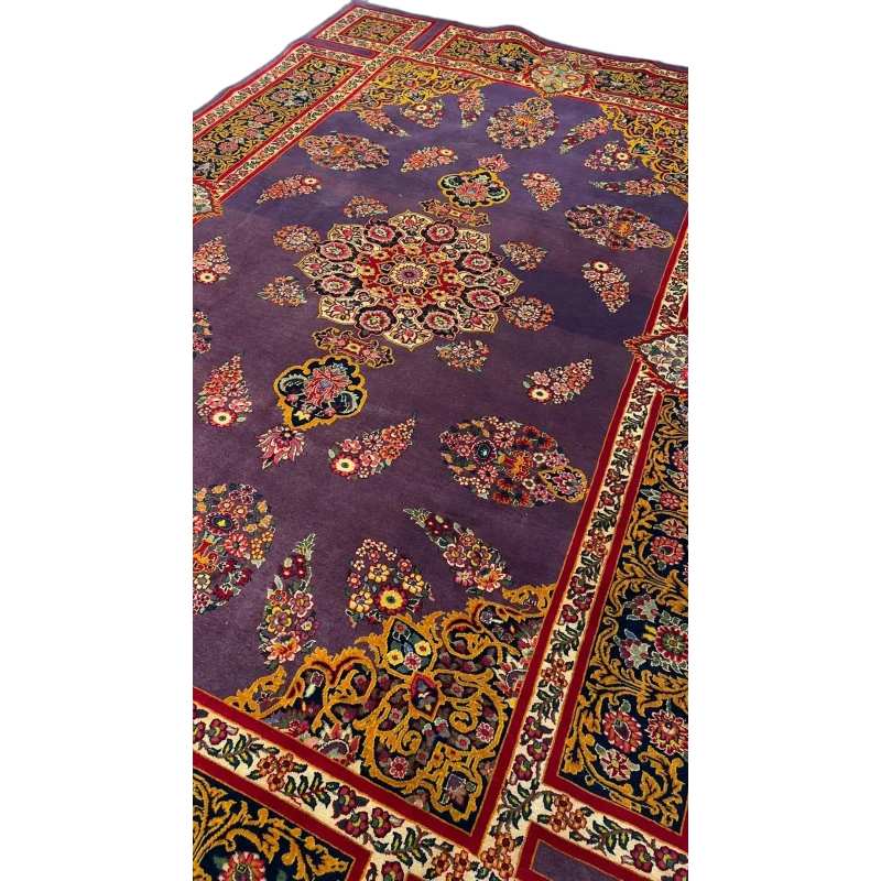 The Elegant Mashad Rug displayed in a room setting to give an idea of its size and design