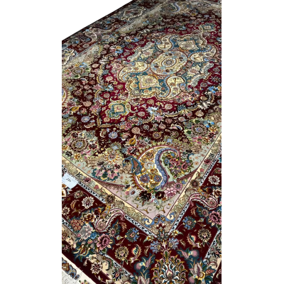 Handcrafted Tabriz rug with intricate medallion pattern for home decor