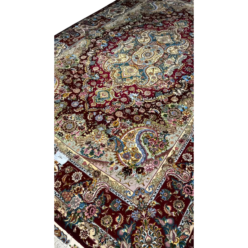 Handcrafted Tabriz rug with intricate medallion pattern for home decor