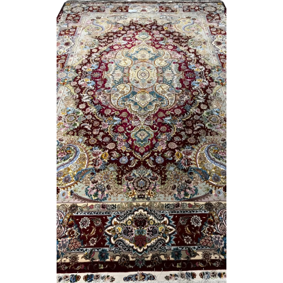 Detailed view of the exquisite craftsmanship on the Tabriz rug with ornate designs