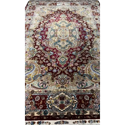 Detailed view of the exquisite craftsmanship on the Tabriz rug with ornate designs