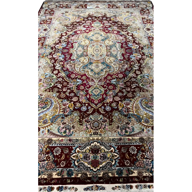 Detailed view of the exquisite craftsmanship on the Tabriz rug with ornate designs