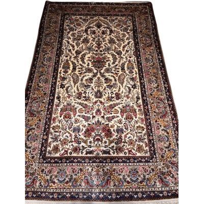 Close-up of the detailed floral motifs on the semi antique Kashan silk rug