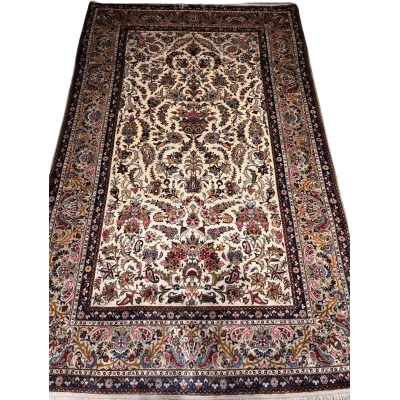Close-up of the detailed floral motifs on the semi antique Kashan silk rug