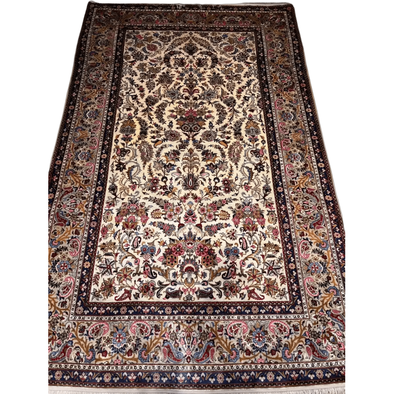 Close-up of the detailed floral motifs on the semi antique Kashan silk rug