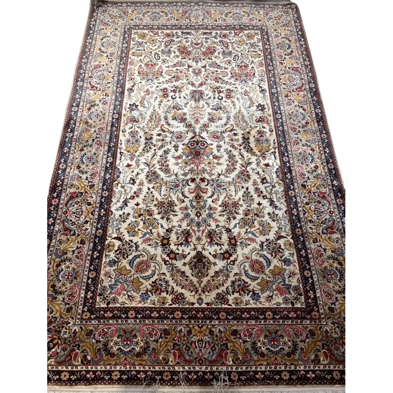 The entire spread of the semi antique full silk Kashan rug showcasing its timeless design
