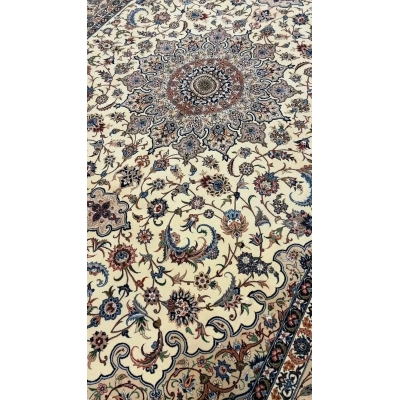 "Elegant Persian rug handcrafted by Ahmad Zojaji in Isfahan, Iran. Measuring 300 cm x 200 cm (9.8 x 6.5 feet), this stunning piece features a wool and silk pile, with a knot density of 810,000 knots per square meter. The intricate floral pattern and luxurious materials create a timeless addition to any space."