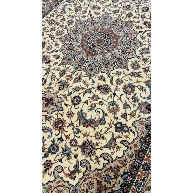 "Elegant Persian rug handcrafted by Ahmad Zojaji in Isfahan, Iran. Measuring 300 cm x 200 cm (9.8 x 6.5 feet), this stunning piece features a wool and silk pile, with a knot density of 810,000 knots per square meter. The intricate floral pattern and luxurious materials create a timeless addition to any space."