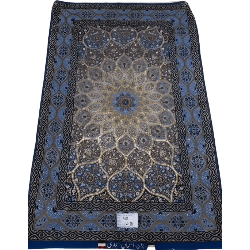 "Hand-knotted Persian rug made of wool and silk, featuring a luxurious design with intricate patterns. Measuring approximately 130 cm x 83 cm (4.2 x 2.7 feet), the rug is crafted in Isfahan, Iran. It has a knot density of 810,000 knots per square meter and is new, woven by the skilled weaver Sajadie. The rug’s blend of wool and silk provides both durability and elegance."