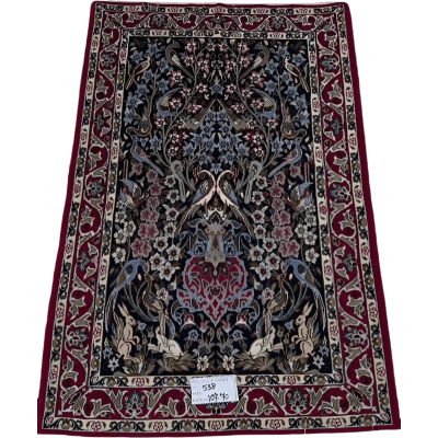  "Hand-knotted Persian rug from Isfahan, made with wool and silk. This luxury rug measures approximately 107 cm x 70 cm (3.5 x 2.3 feet) and features intricate floral and bird designs with a knot density of 810,000 knots per square meter. Perfect for adding sophistication to living spaces."