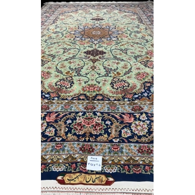 Traditional light green Persian carpet showcasing handcrafted design details