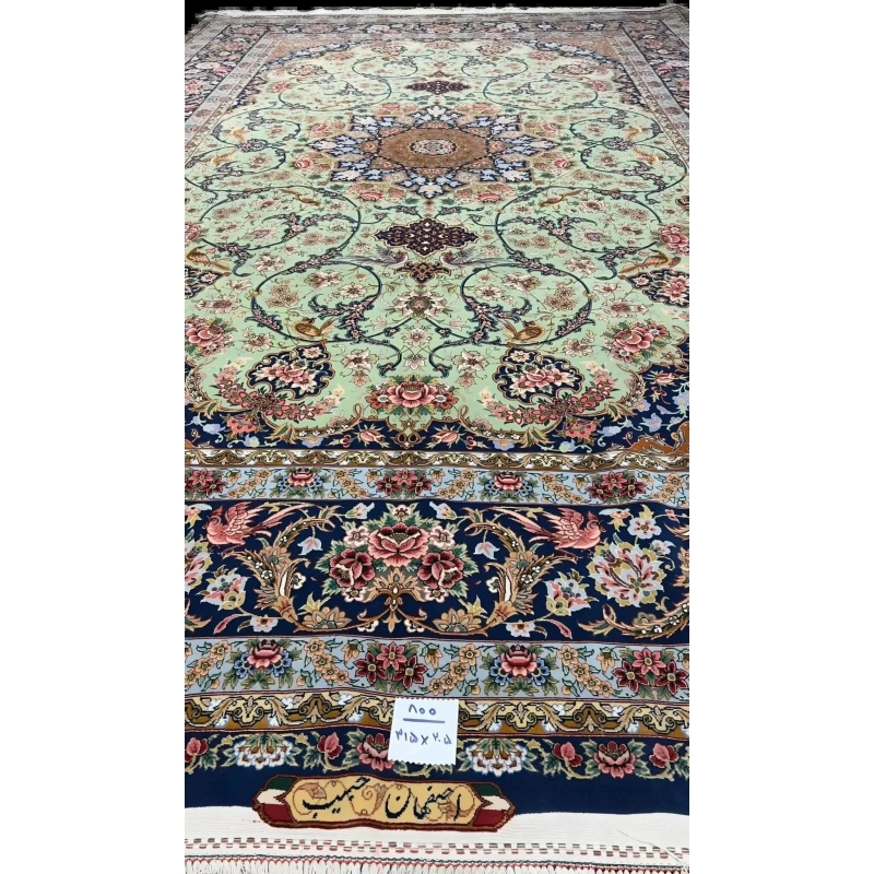 Traditional light green Persian carpet showcasing handcrafted design details