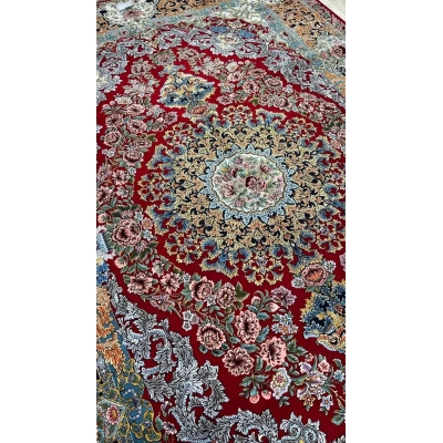 Handcrafted Persian rug with red base and floral patterns for sale