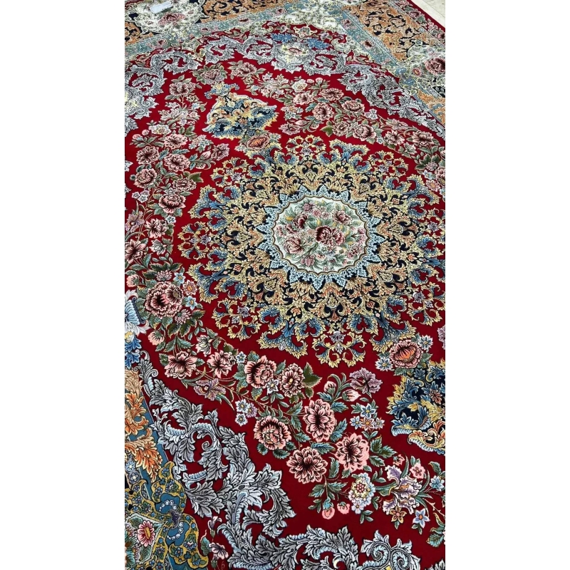 Handcrafted Persian rug with red base and floral patterns for sale