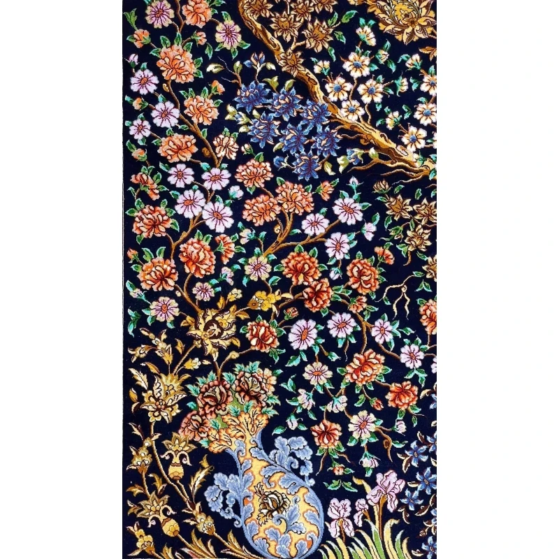Persian rug featuring a Tree of Life pattern with gold and blue floral accents on a black field