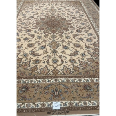 Hand-Knotted Persian Rug by Mohaghegh – 305x205 cm: This hand-knotted Persian rug from Isfahan, featuring a blend of wool and silk in elegant brown and beige tones, is perfect for elevating home interiors. Crafted by master weaver Mohaghegh, it offers luxurious quality and timeless design.

