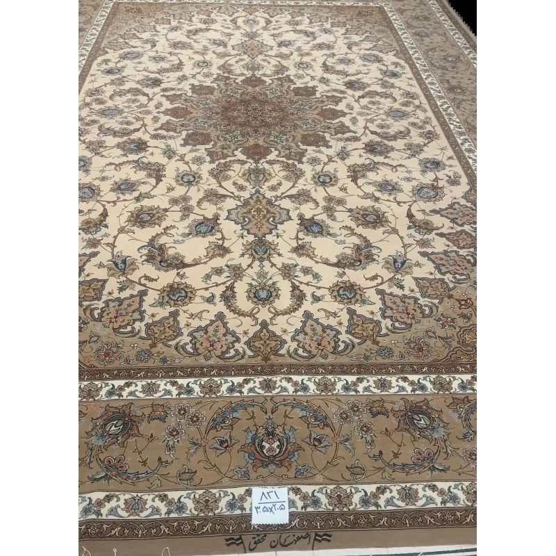 Hand-Knotted Persian Rug by Mohaghegh – 305x205 cm: This hand-knotted Persian rug from Isfahan, featuring a blend of wool and silk in elegant brown and beige tones, is perfect for elevating home interiors. Crafted by master weaver Mohaghegh, it offers luxurious quality and timeless design.
