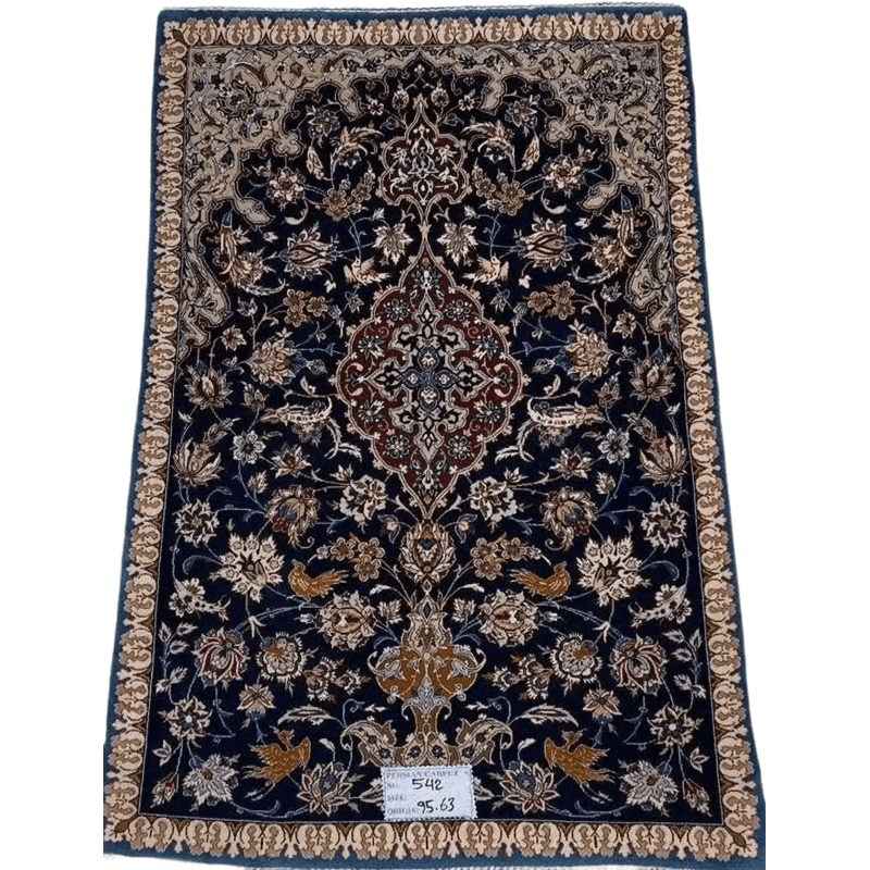 "Small vintage Persian carpet, hand-knotted in Isfahan, Iran, measuring 95 cm x 63 cm (3.1 x 2.1 feet). Made with wool and silk, this 70-year-old rug is in great condition, featuring intricate designs that reflect its rich heritage."