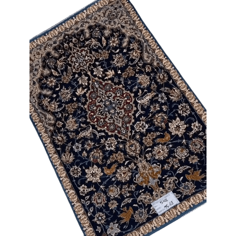 "Antique Persian carpet from Isfahan, Iran, handcrafted with wool and silk. The rug measures 95 cm x 63 cm (3.1 x 2.1 feet) and has a knot density of 1,000,000 knots per square meter. A 70-year-old vintage piece with intricate detailing."
