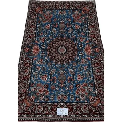"Unique Isfahan rug handcrafted from wool and silk, featuring intricate Persian designs. This luxury rug measures approximately 130 cm x 85 cm (4.2 feet x 2.8 feet) with a knot density of 810,000 knots per square meter. The rug is new, made in Isfahan, Iran, and knotted by hand with a silk warp and wool-silk pile, making it a perfect addition to luxury home decor."