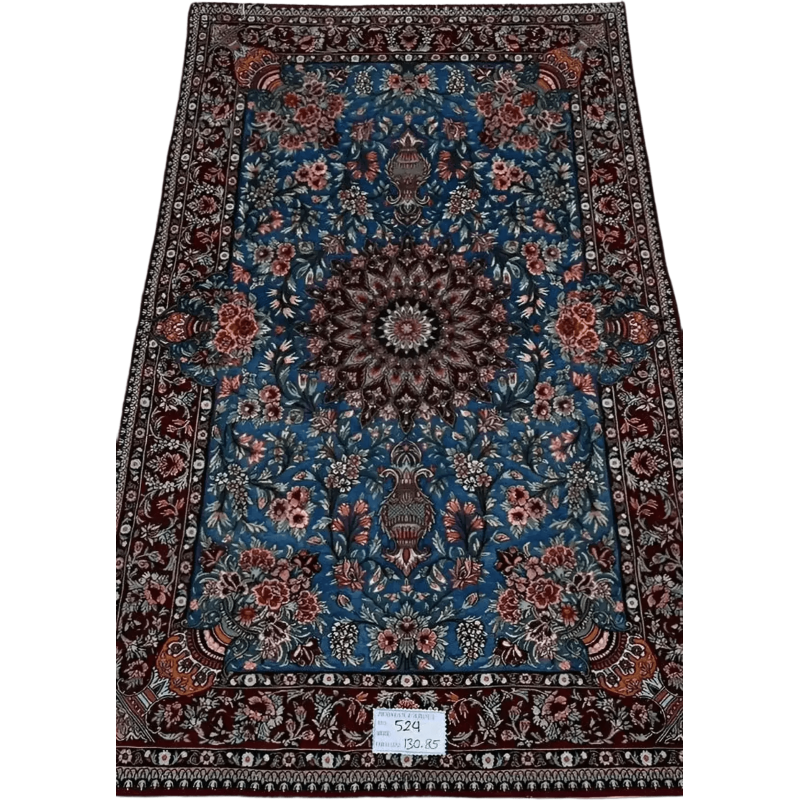 "Unique Isfahan rug handcrafted from wool and silk, featuring intricate Persian designs. This luxury rug measures approximately 130 cm x 85 cm (4.2 feet x 2.8 feet) with a knot density of 810,000 knots per square meter. The rug is new, made in Isfahan, Iran, and knotted by hand with a silk warp and wool-silk pile, making it a perfect addition to luxury home decor."