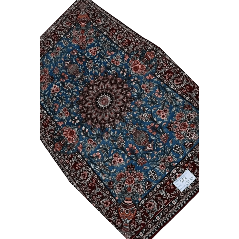 "Hand-knotted Persian Isfahan rug, made with a blend of wool and silk. The rug measures 130 cm x 85 cm (4.2 x 2.8 feet) with intricate detailing and a knot density of 810,000 knots per square meter. A luxurious piece designed for modern home decor with traditional Persian craftsmanship, featuring both elegance and durability."